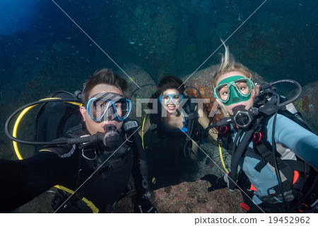 diver making a selfie on corals reef background 19452962