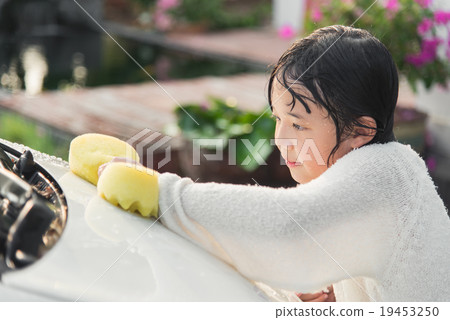 Beautiful asian child washing car Beautiful asian child washing car 19453250
