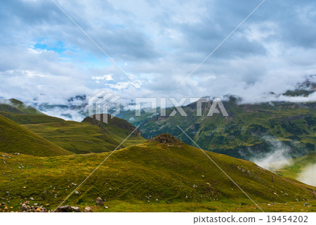 The Grossglockner mountains in foggy weather 19454202