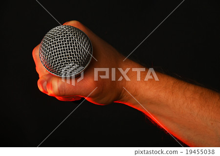 Male hand with microphone and red light on black 19455038