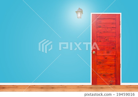 Wooden door and lamp with blue wall texture. 19459016