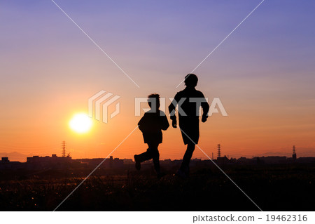 Parent and child jogging with the sun back Parent and child jogging with the sun back 19462316