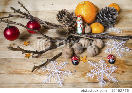 Citrus fruits, chocolate, nuts with cones Citrus fruits, chocolate, nuts with cones 19462776
