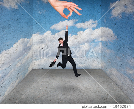 Big hand holding businessman in rough room 19462984