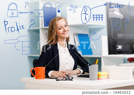 Woman sitting at the desk with computer 19463012