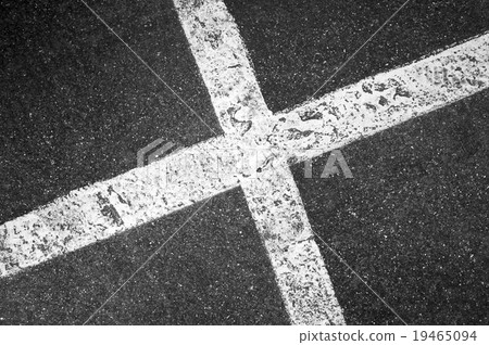 Crossing white lines on black asphalt, parking lot 19465094