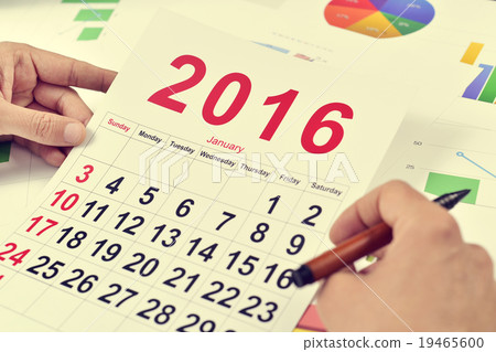 young businessman with a 2016 calendar young businessman with a 2016 calendar 19465600