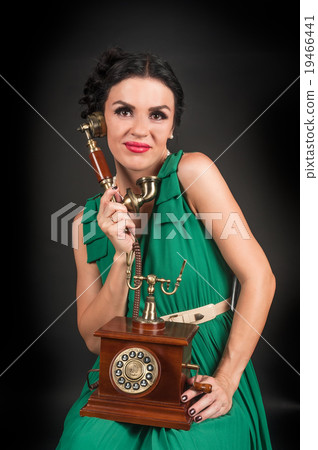Pretty woman with retro phone 19466441