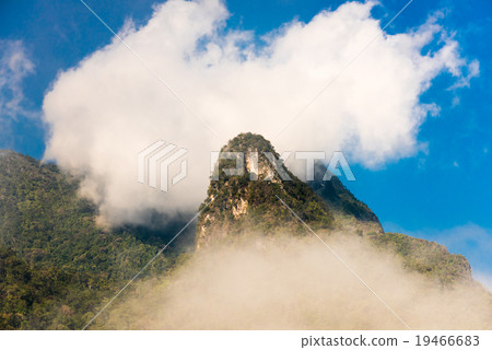 High mountain ridge in thick fog 19466683
