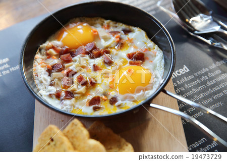 fried egg stuff with hot pan 19473729