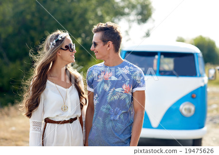 smiling young hippie couple over minivan car smiling young hippie couple over minivan car 19475626