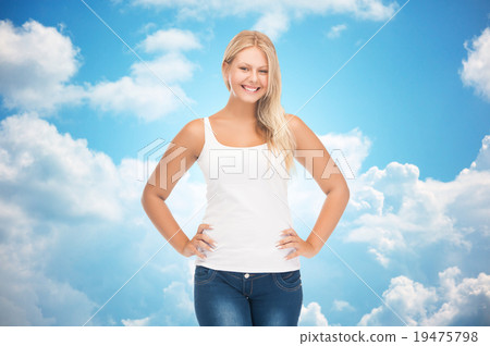 smiling young woman in blank white shirt and jeans 19475798