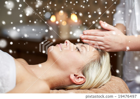 close up of woman having face massage in spa salon close up of woman having face massage in spa salon 19476497