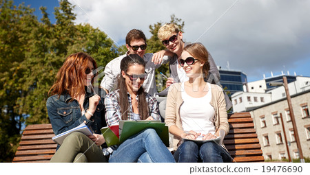group of happy students with notebooks at campus group of happy students with notebooks at campus 19476690