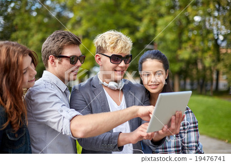 students or teenagers with tablet pc taking selfie students or teenagers with tablet pc taking selfie 19476741