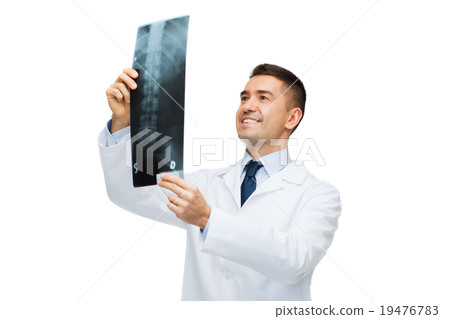smiling male doctor in white coat looking at x-ray 19476783