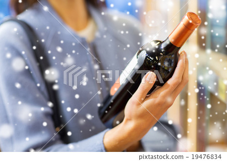 happy woman choosing and buying wine in market happy woman choosing and buying wine in market 19476834