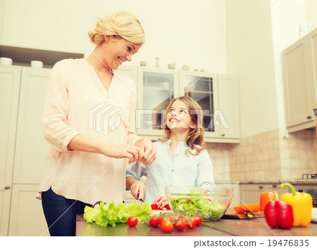 happy family making dinner in kitchen happy family making dinner in kitchen 19476835