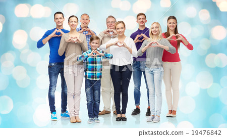 group of smiling people showing heart hand sign 19476842