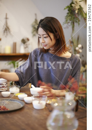 A woman enjoying organic cosmetics 19478362