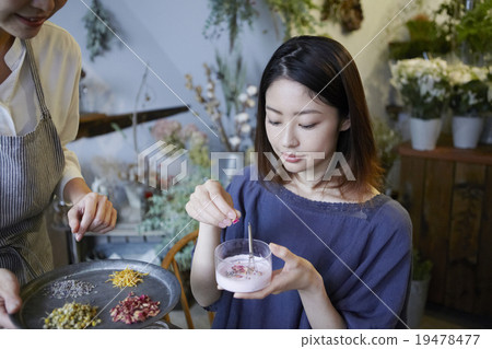 A woman enjoying organic cosmetics A woman enjoying organic cosmetics 19478477
