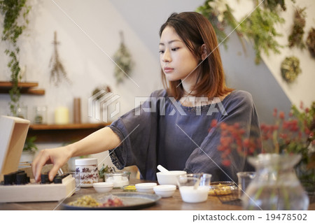 A woman enjoying organic cosmetics A woman enjoying organic cosmetics 19478502