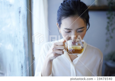 A woman relaxing at the window 19478540