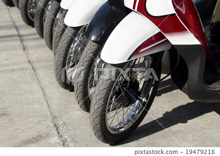 Row of motorcycles on the street Row of motorcycles on the street 19479218