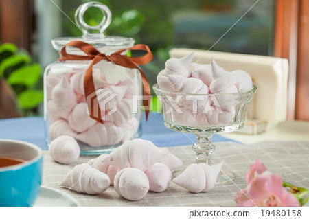 The meringue kisses in the glass vase and jars 19480158
