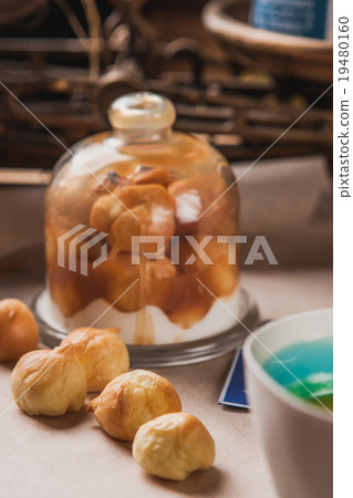 The cakes and cake plate with glass cover  19480160