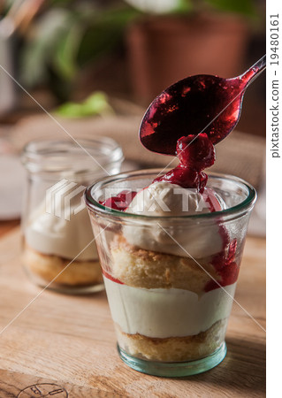 Layered dessert in glasses 19480161