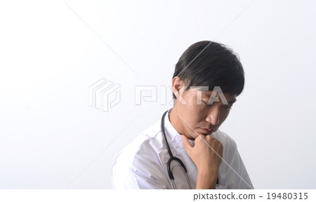 Young male doctor / nurse thinking Young male doctor / nurse thinking 19480315