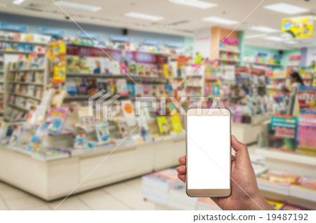 Smart phone white screen in hand on blurred 19487192