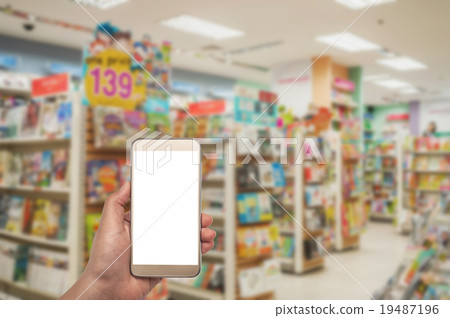 Smartphone white screen in hand on blurred Smartphone white screen in hand on blurred 19487196