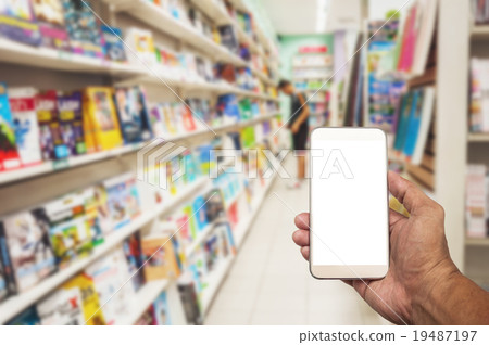 Smartphone white screen in hand on blurred Smartphone white screen in hand on blurred 19487197