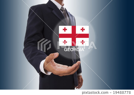 Businessman hand showing Georgia Flag 19488778