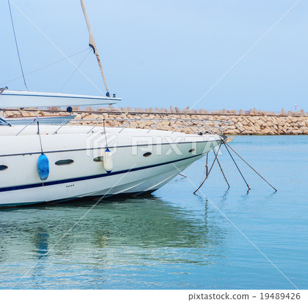 yacht in the harbor standing on an anchor 19489426