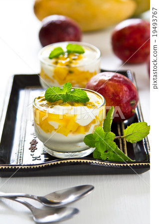Yogurt with fresh Passionfruit and Mango puree Yogurt with fresh Passionfruit and Mango puree 19493767