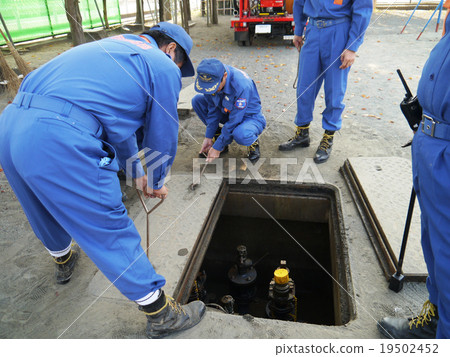 Disaster drill Underground water tank Open lid 19502452