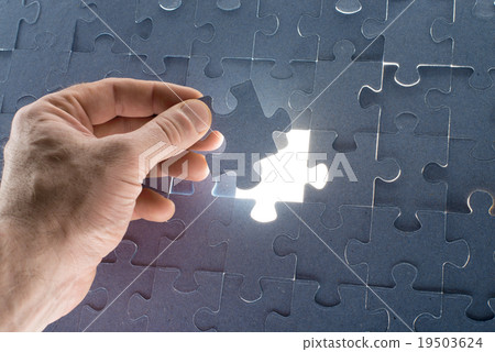Missing jigsaw puzzle piece with light glow Missing jigsaw puzzle piece with light glow 19503624