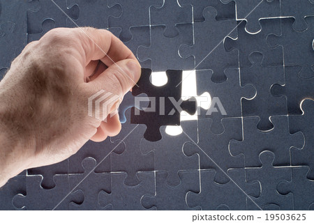 Missing jigsaw puzzle piece with light glow 19503625