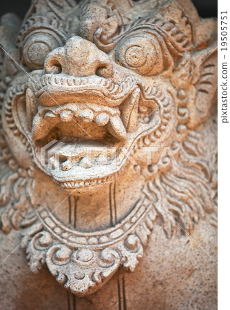 Muzzle of terrible mythical monster. Stone statue Muzzle of terrible mythical monster. Stone statue 19505751