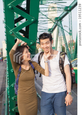 couples of younger asian man and woman relaxing  19511239