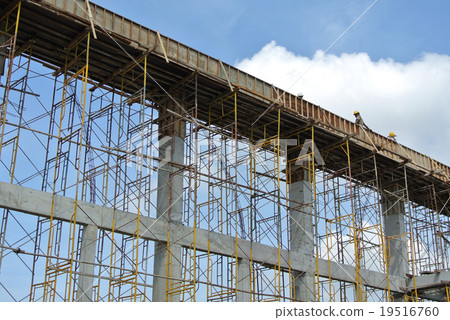 Construction worker fabricating beam form work Construction worker fabricating beam form work 19516760