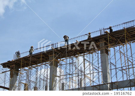 Construction worker fabricating beam form work Construction worker fabricating beam form work 19516762