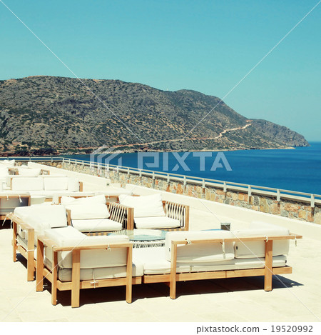 Terrace seaview with lounge sofa in luxury resort 19520992