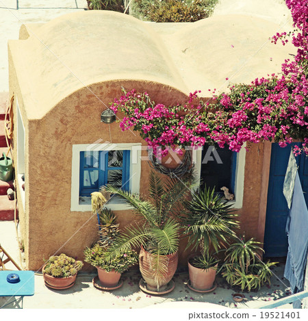 greek building with patio and flowers, Santorini greek building with patio and flowers, Santorini 19521401