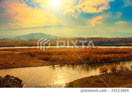 Foggy sunset over mountain river Foggy sunset over mountain river 19523804