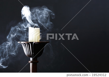 Extinguished Candle On Dark 19524312