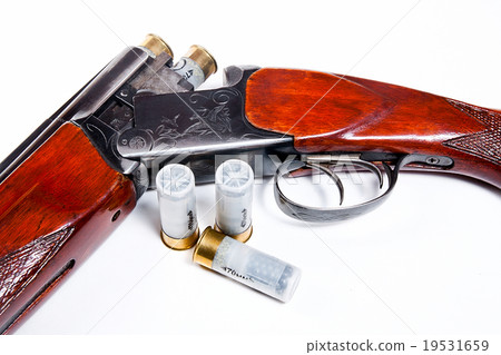 Hunting shotgun and ammunition on white. Hunting shotgun and ammunition on white. 19531659